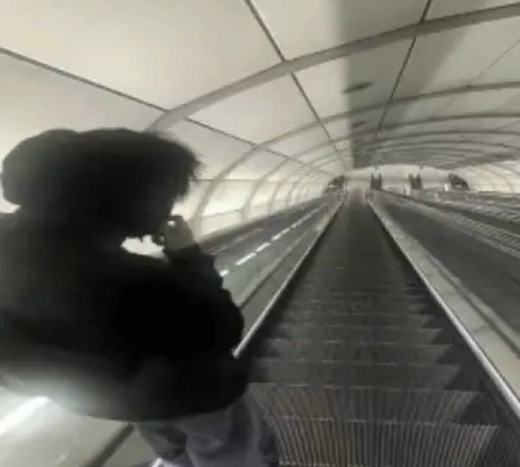 Atmospheric silhouette on an escalator